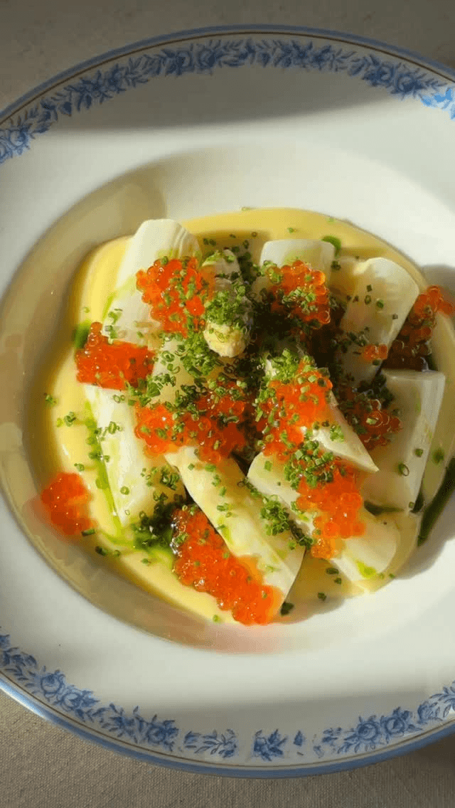 Butter-Cooked White Asparagus with Sandefjord Sauce, Dill Oil, and Trout Roe